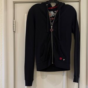 TWISTED HEART Black Zip Hoodie with Metallic Crest and Red Heart Accent